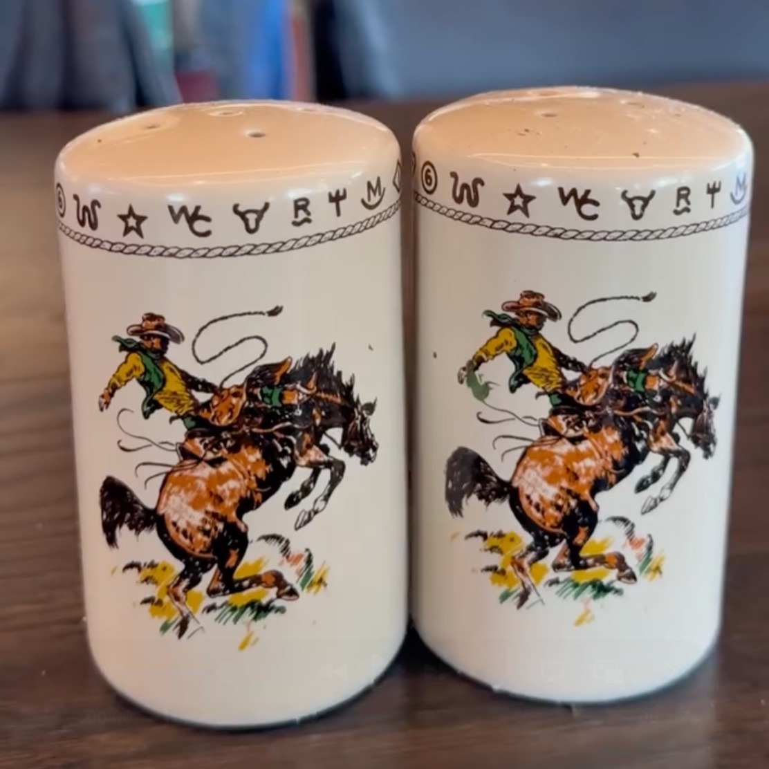 Ceramic salt and pepper shakers with a cowboy illustration