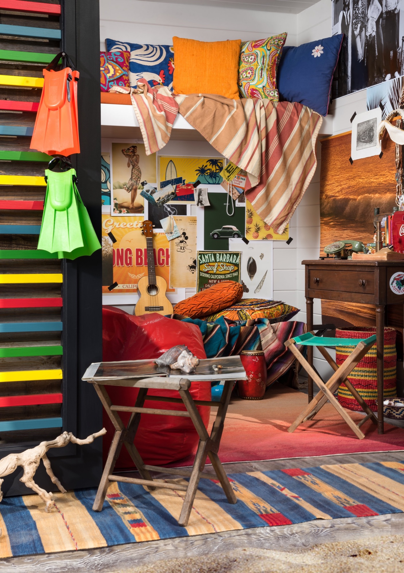 Layered rugs and cushions inside the Boho Beach House playhouse