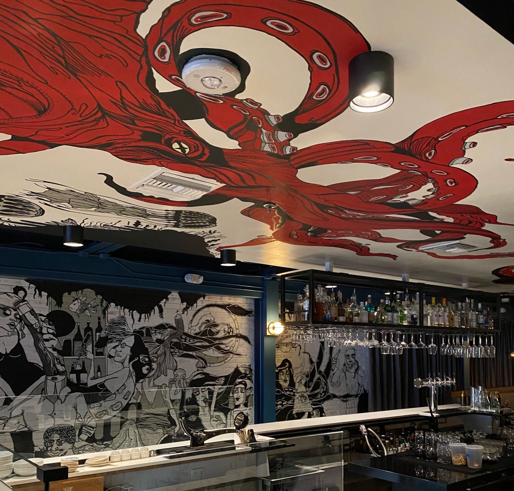 Red octopus mural spanning the bar ceiling at Pa’La