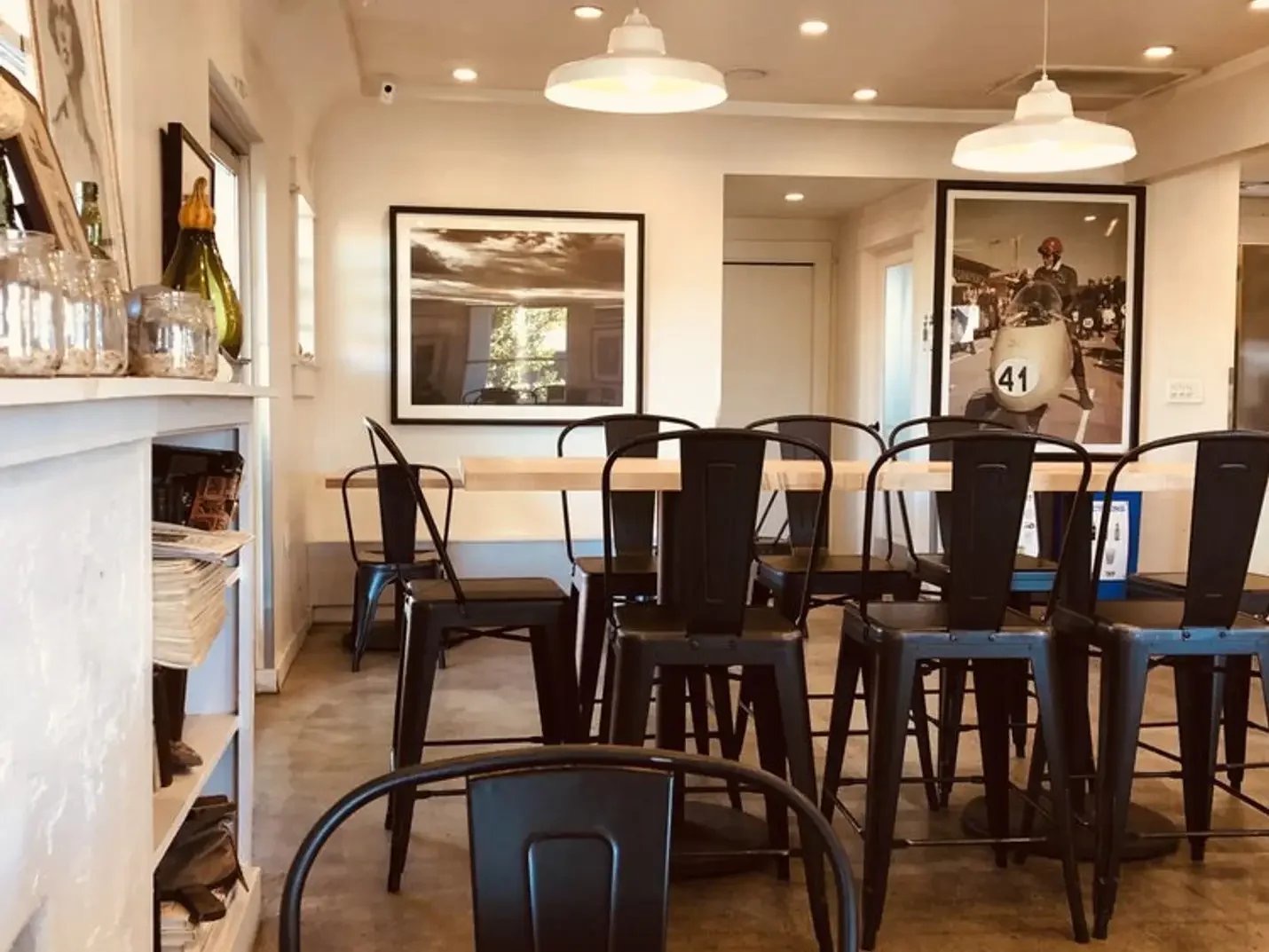 Dining room with bistro chairs and framed art at Pa’La