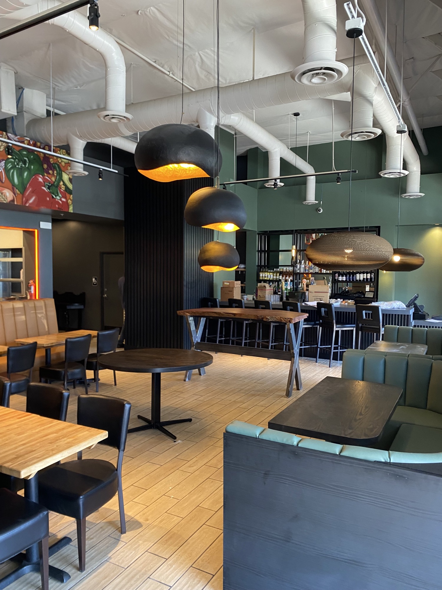 Dining room with pendant lighting at Pita Jungle Arcadia