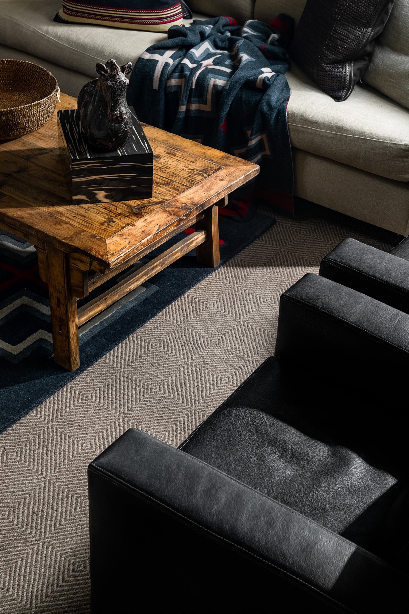 Living room with a leather chair and a reclaimed wood table