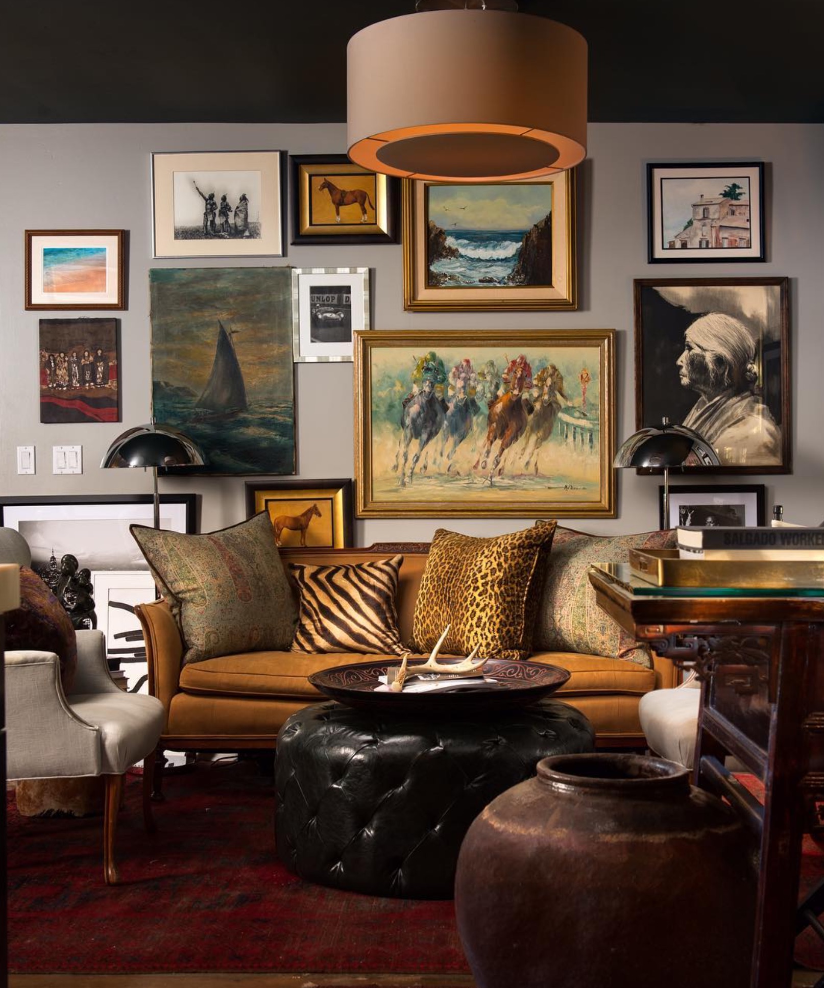 Sitting room layered with a collected gallery wall